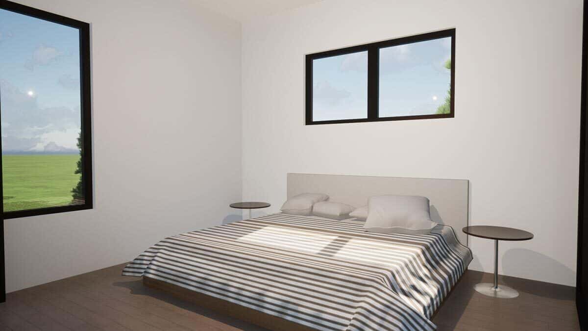Primary bedroom with a platform bed, round nightstands, and large windows that look the expansive backyard.