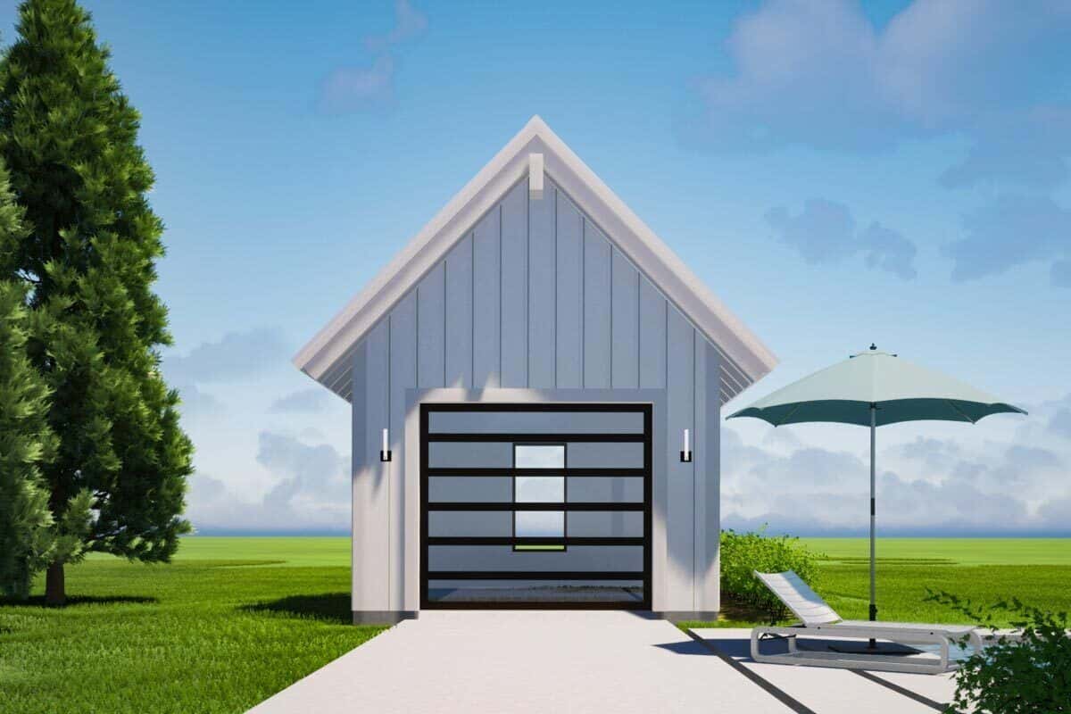 Detached garage with a gable roof and a large glazed door.