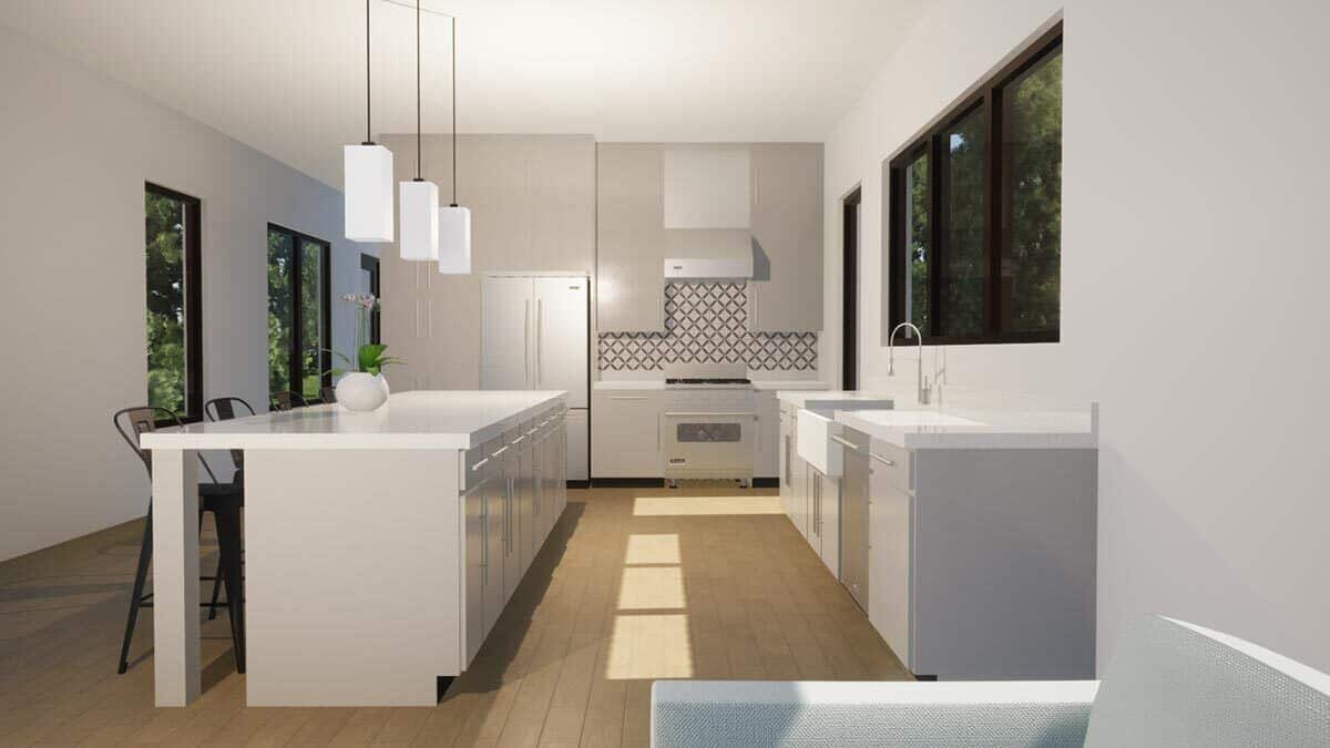Kitchen with custom cabinets, stainless steel appliances, and a breakfast away topped with modern pendant lights.