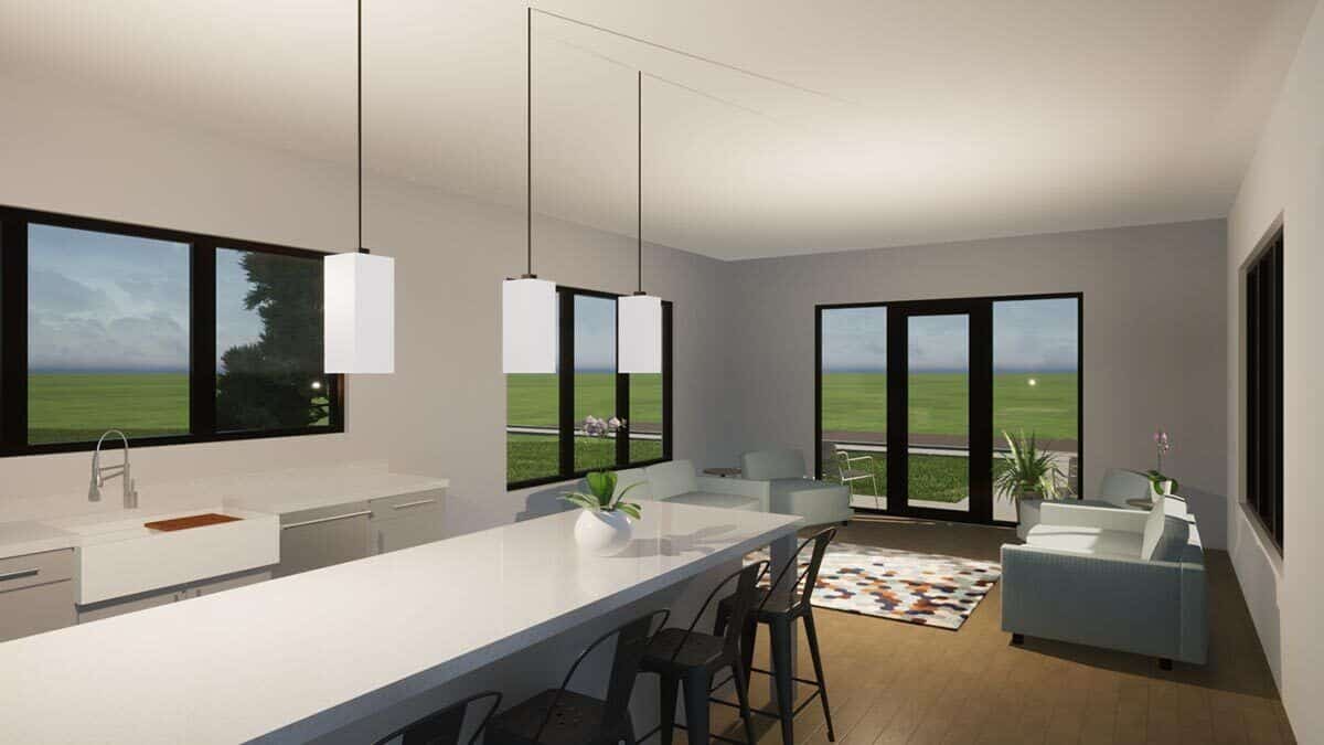 Kitchen and living room with hardwood flooring and aluminum-framed windows and doors.