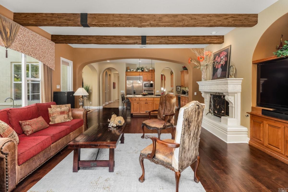Living room with a fireplace and a large TV.