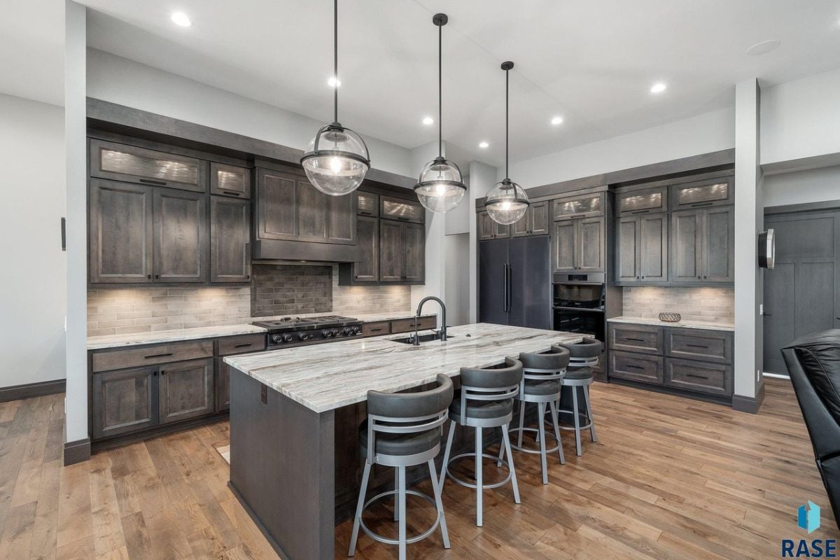 Kitchen with custom cabinetry and custom lighting.