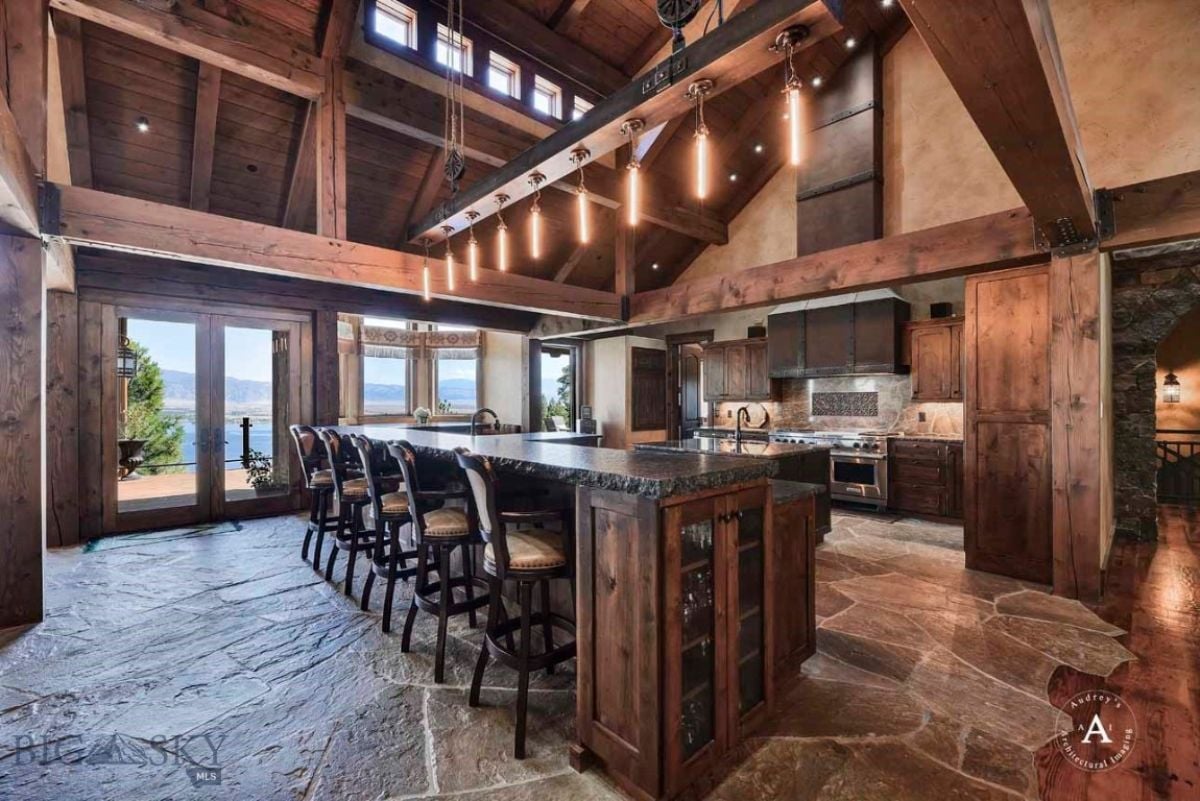 Kitchen with vaulted ceiling and custom lighting.