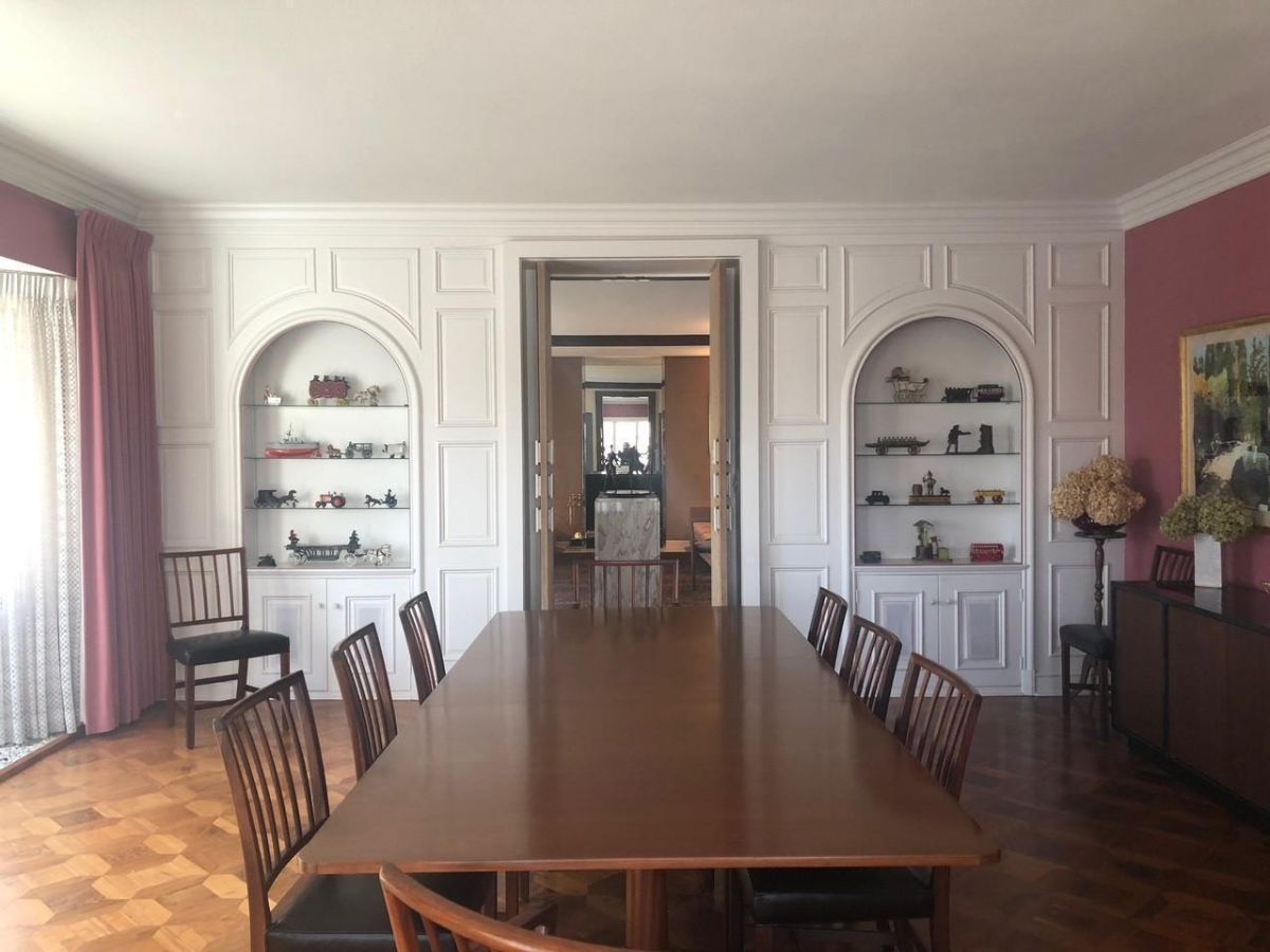 Dining room with a wooden table and chairs.