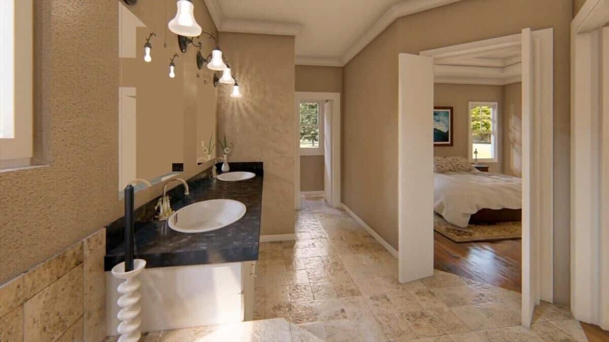 Primary bathroom with double doors and a dual sink vanity topped with frameless mirrors and wrought iron sconces.