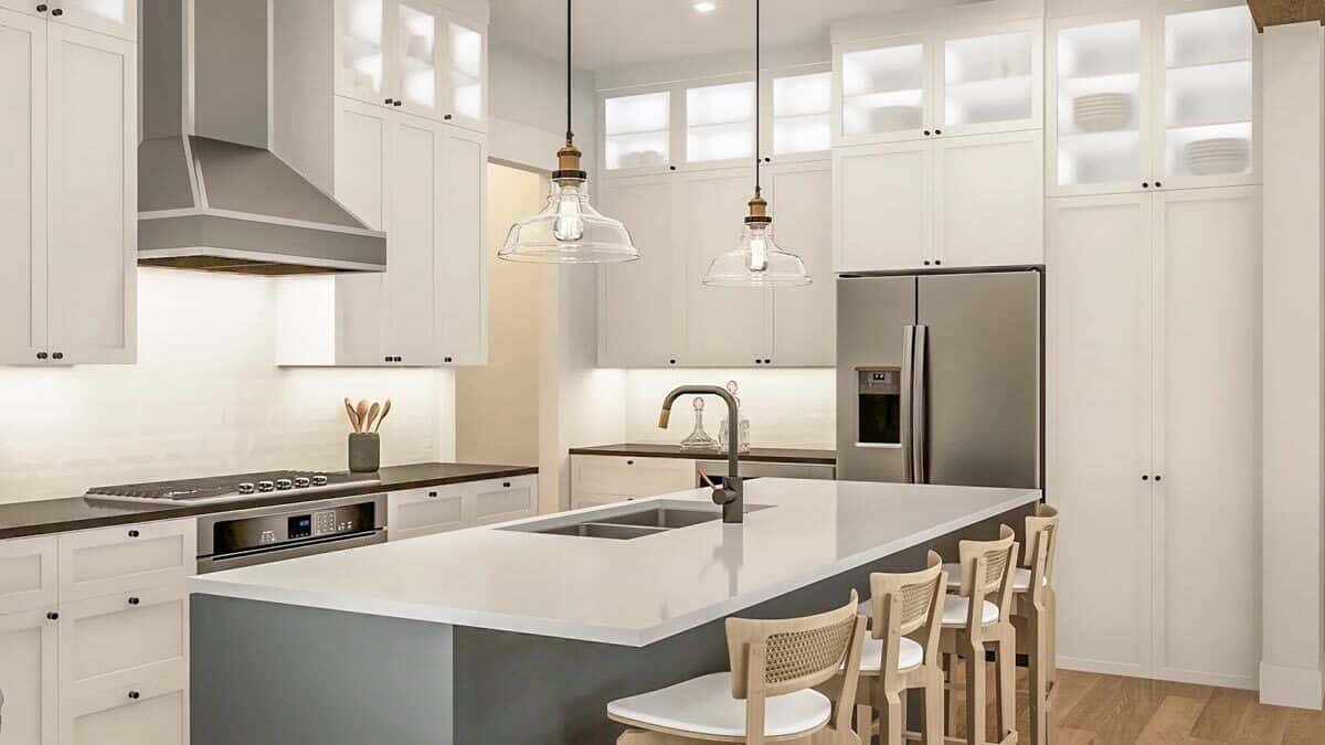 The kitchen includes double sinks fitted on the breakfast island.