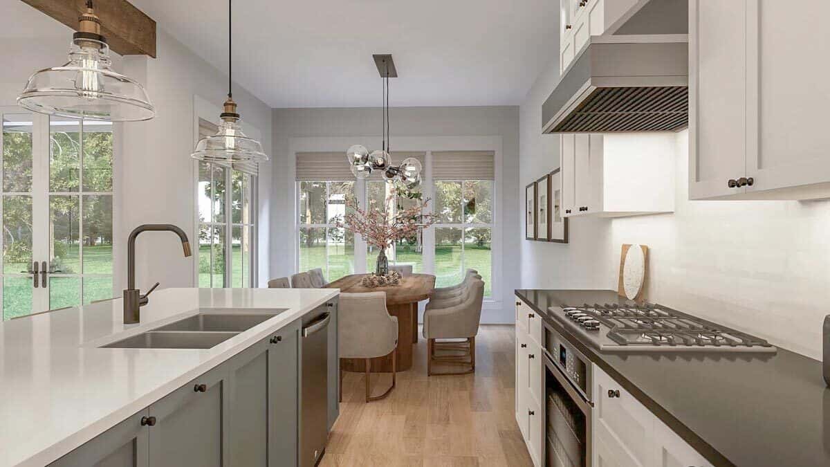 Across the kitchen is the dining area surrounded by large windows.