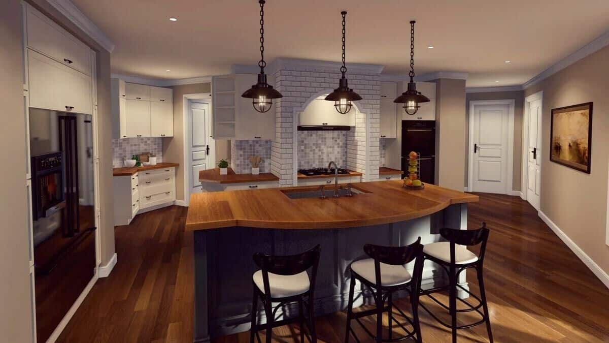 Kitchen with white cabinets, modern appliances, and a center island with a sink and a curved eating bar.