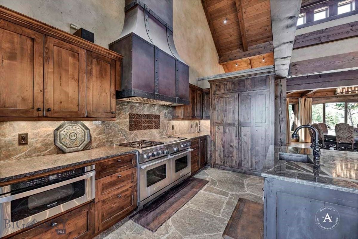 Kitchen with custom cabinetry, a stove and oven.