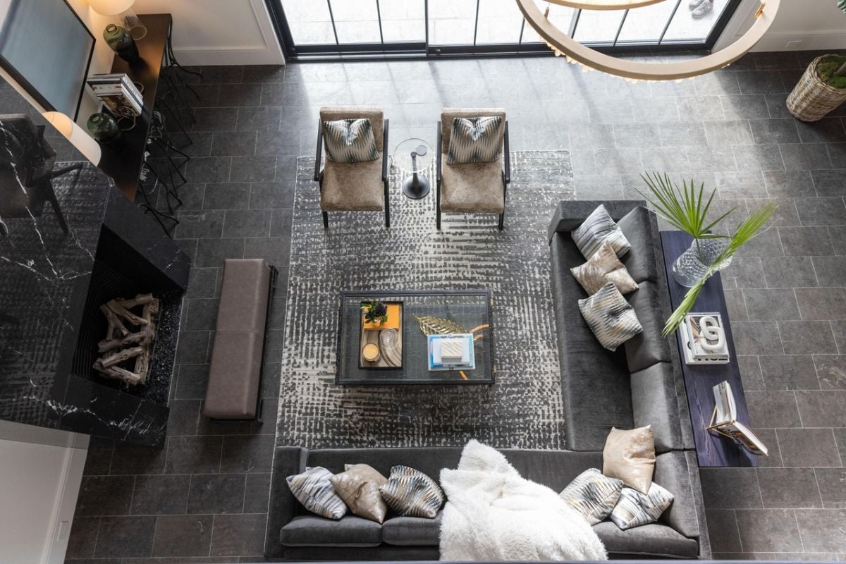Top view of the living room with couches and a fireplace.