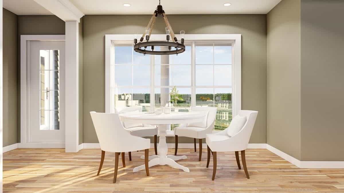 Breakfast nook with a round dining set topped with a round chandelier.