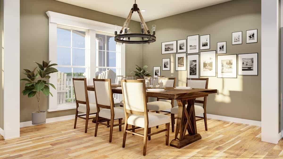 Dining room with a 6-seater dining set and gray walls adorned with framed artworks.