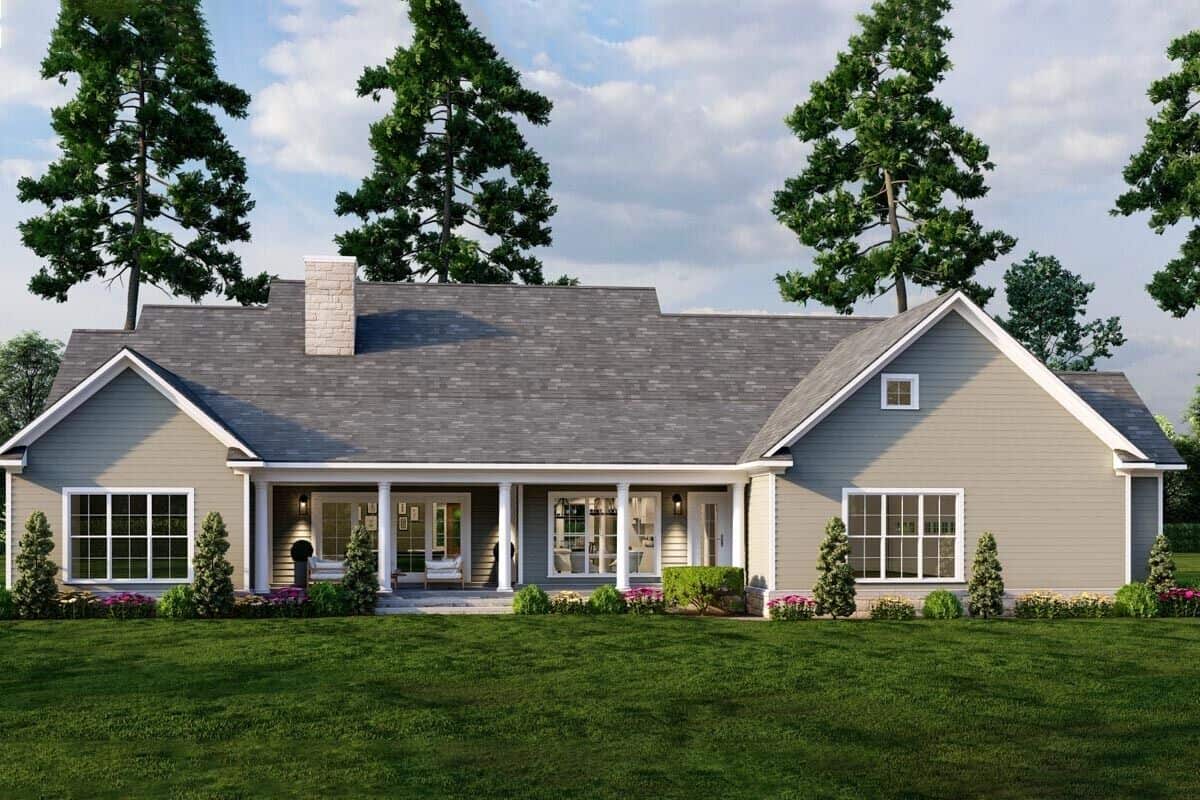 Rear rendering with gable rooflines, a stone chimney, and a spacious covered porch.