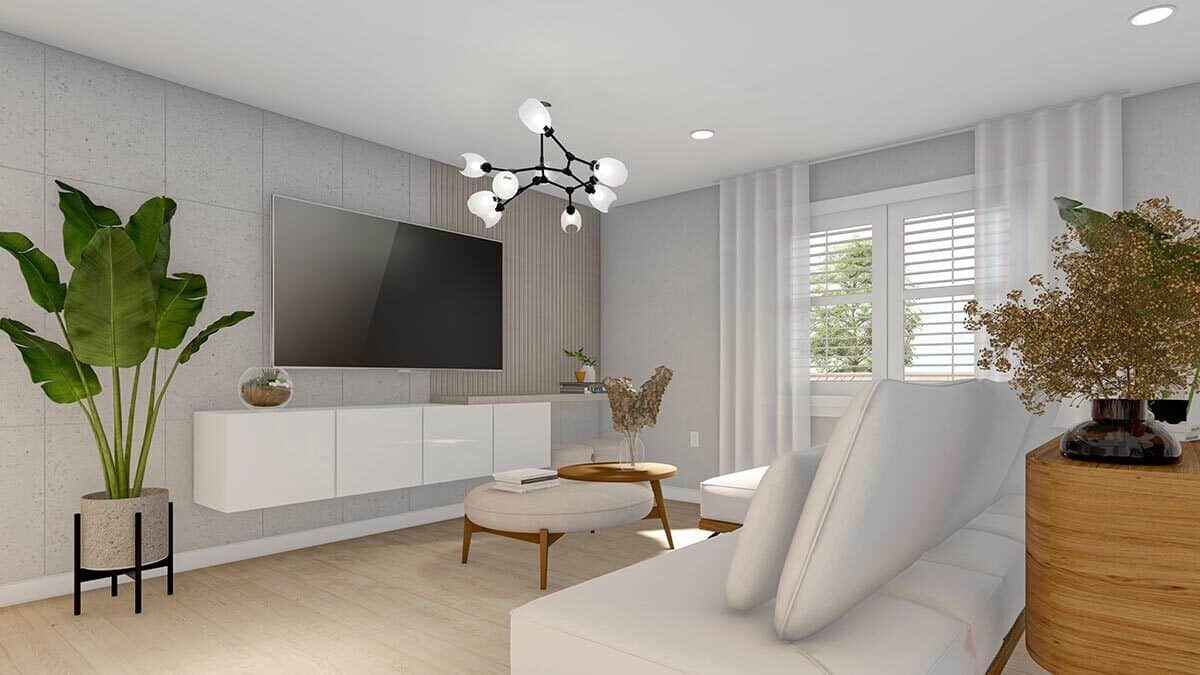 Family room with a large TV mounted above the floating console table.