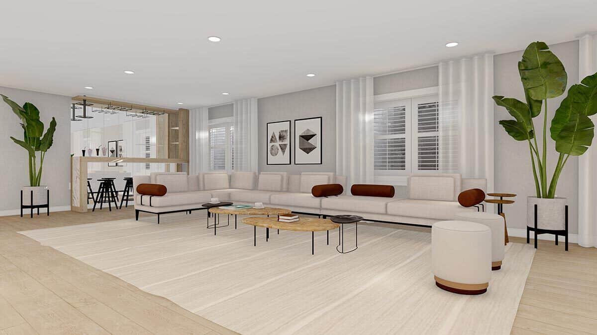 Lower-level family room with an L-shaped sectional, round stools, nesting coffee tables, and a wet bar.