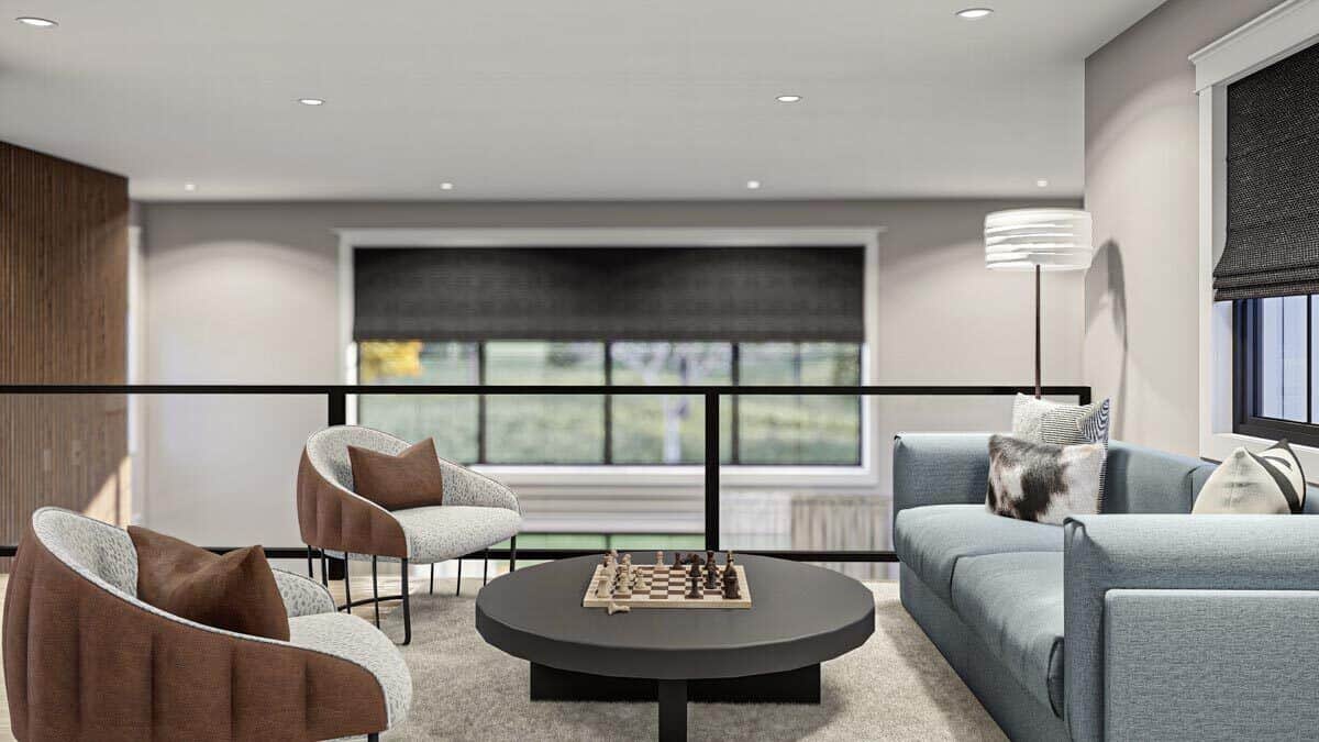 Loft with round-back chairs and a modern sofa surrounding the dark wood coffee table.