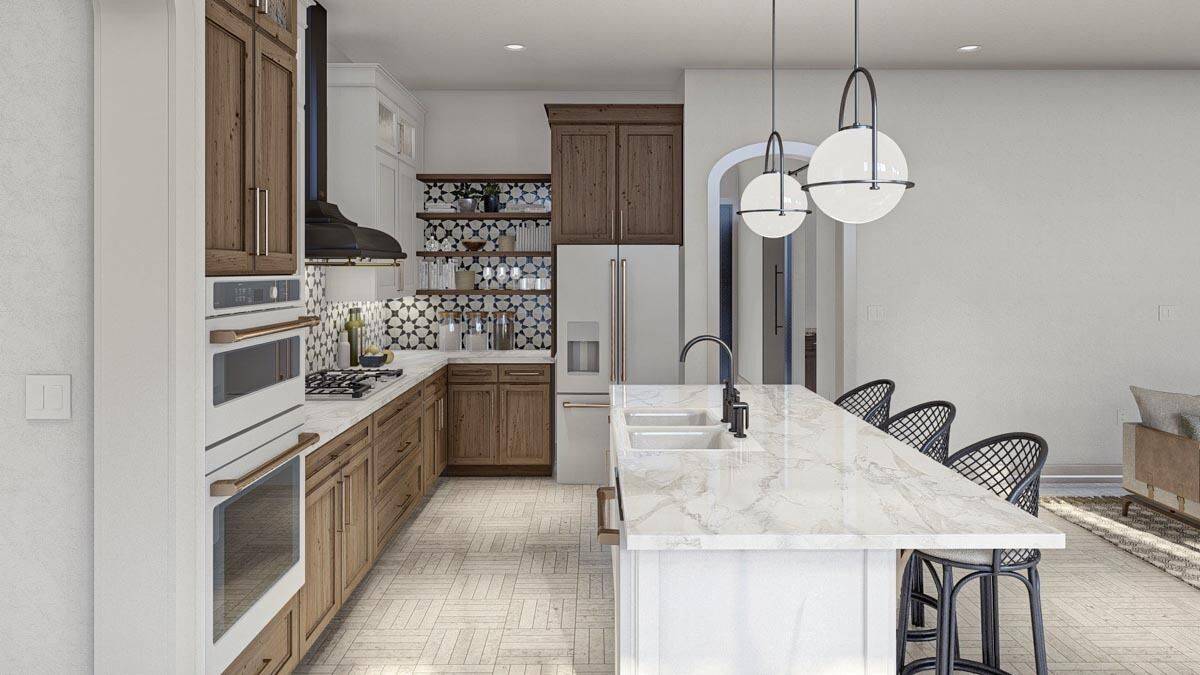 The kitchen includes double sinks and floating shelves fixed against the decorative tiled backsplash.