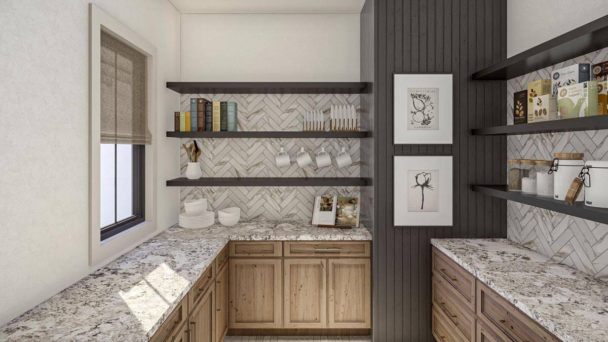 Walk-in pantry with granite countertops, wooden cabinets, and floating shelves against the herringbone-tiled backsplash.