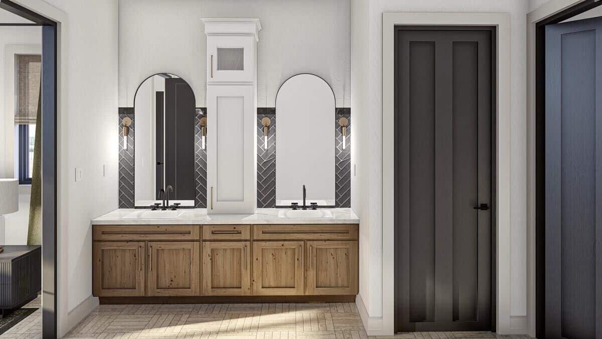 Primary vanity with two sinks, arched mirrors, and a marble countertop.