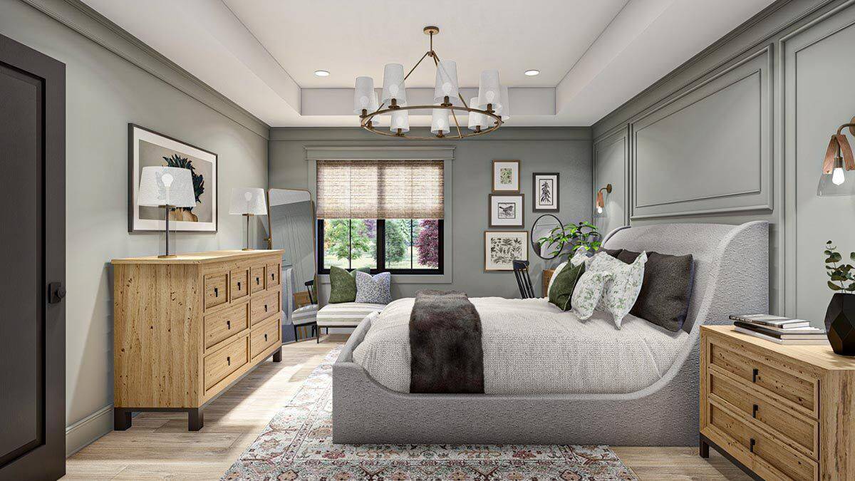 Primary bedroom with a paneled accent wall, a wingback bed, wooden cabinets, and a floral rug that lays on the hardwood flooring.