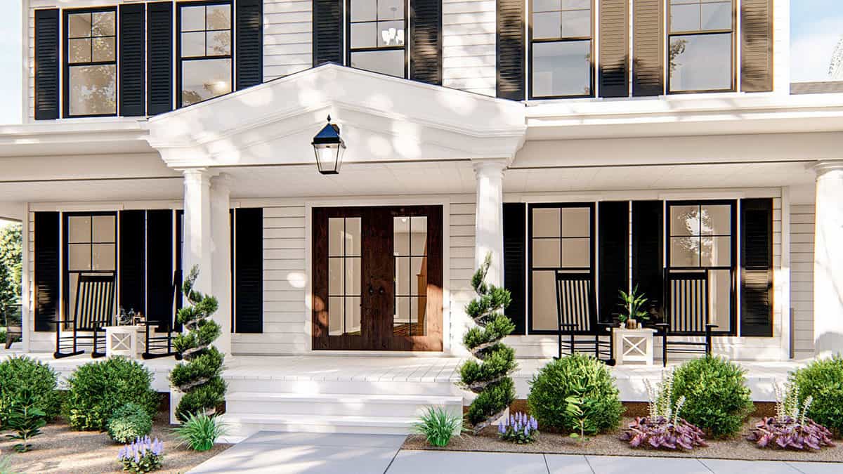 Entry porch with a central gable, a concrete stoop, and a French front door.