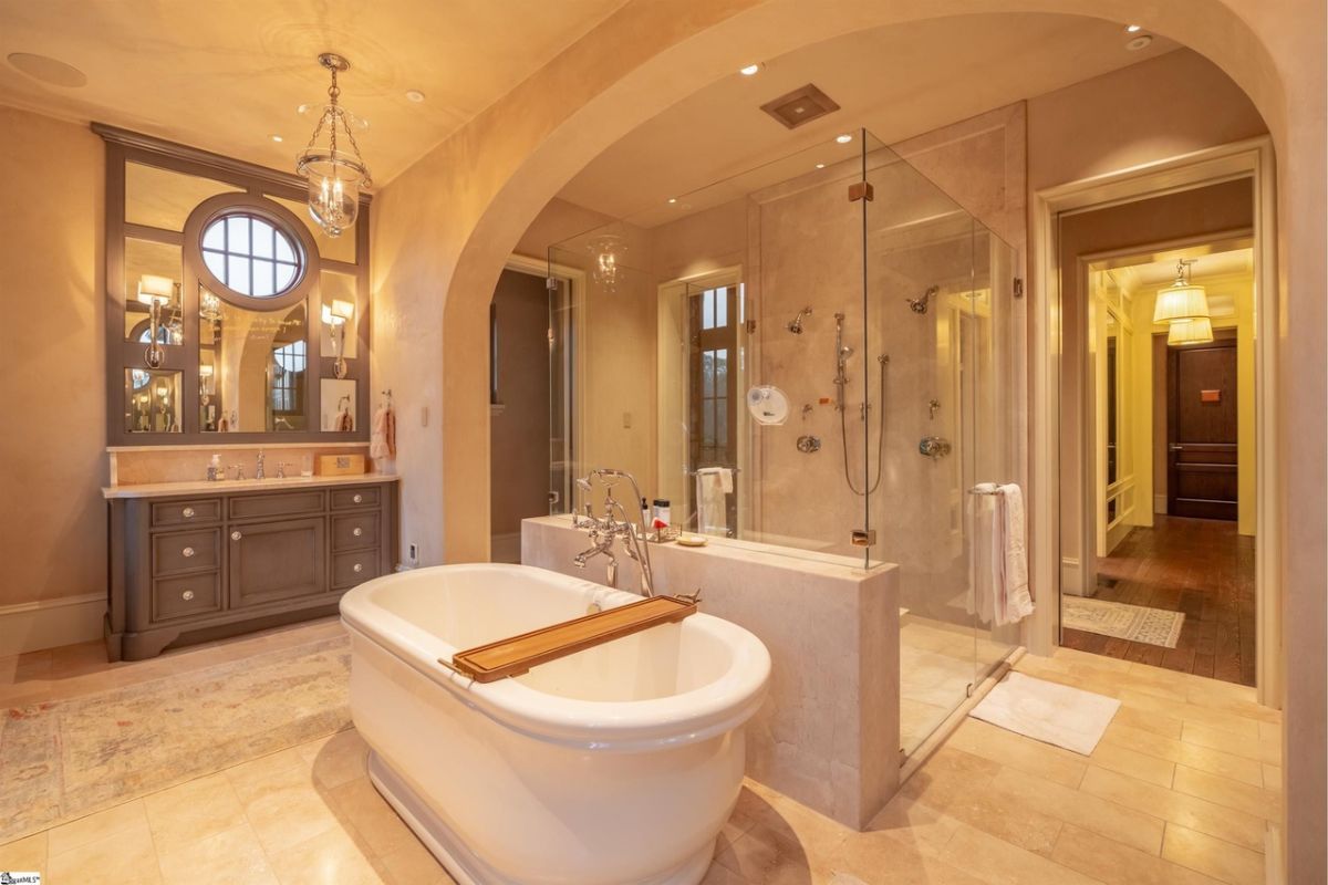 Bathroom with a sink, shower and a bath tub.