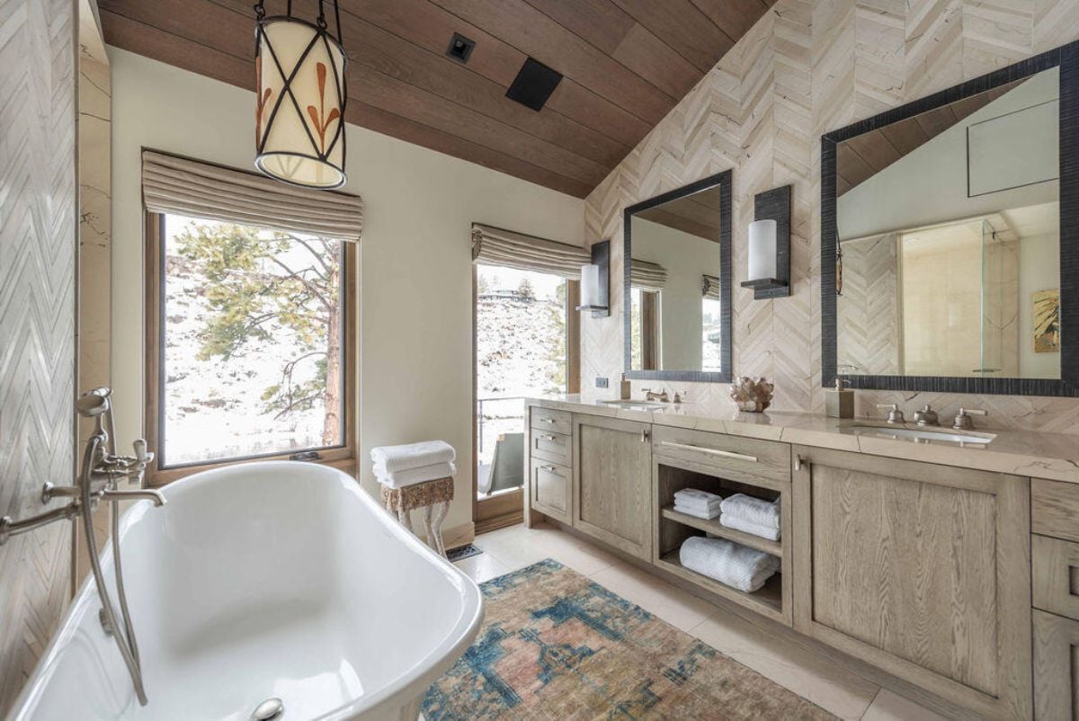 Bathroom with a soaking tub and custom cabinetry.