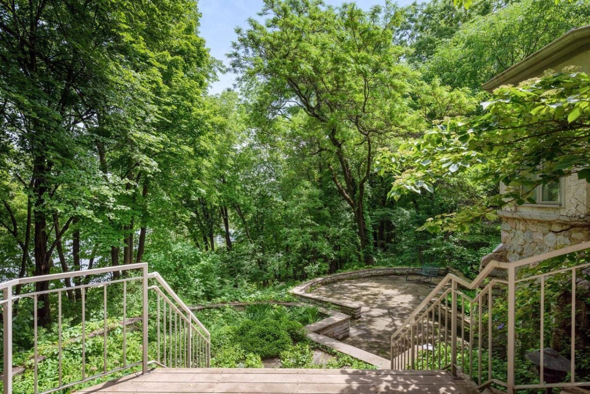 Stone staircase leading up to the patio and lake.