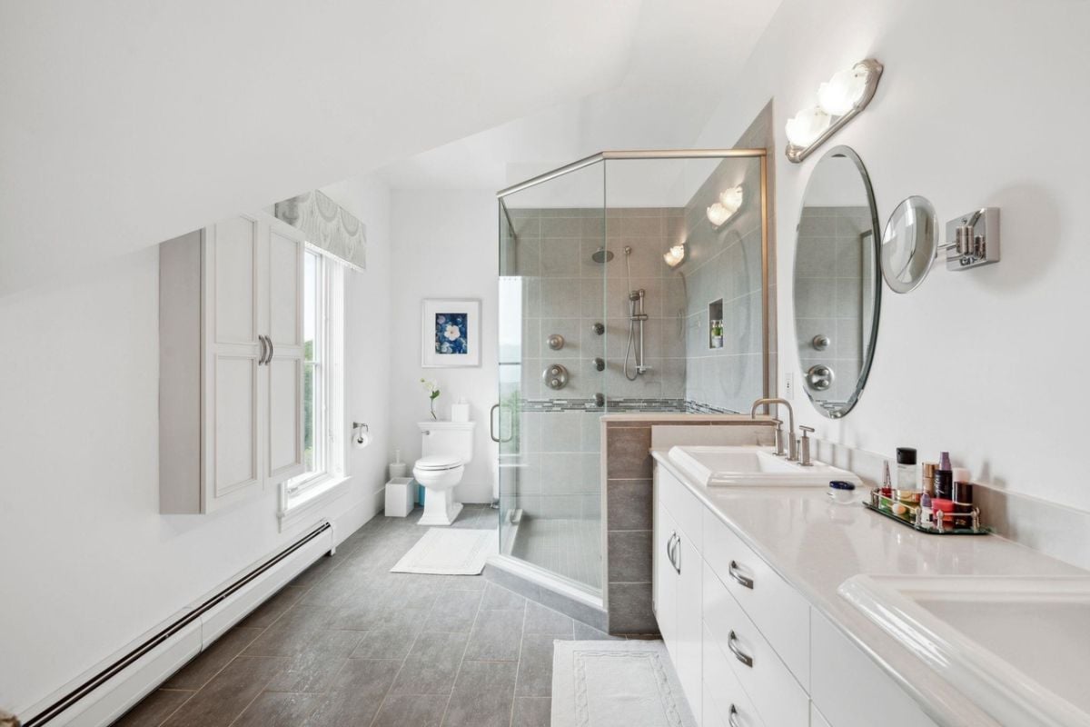 Bathroom with a sink, shower, and a toilet.