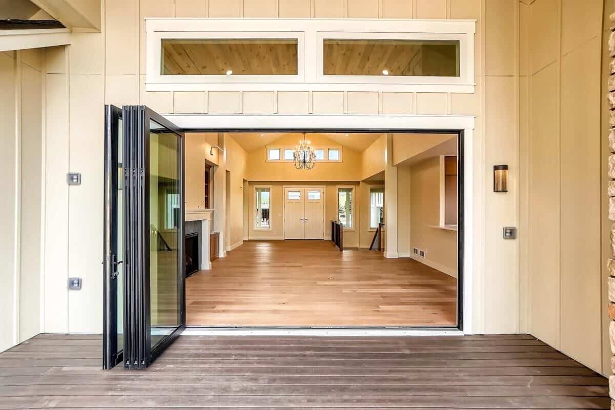 Retractable doors create a smooth transition between the great room and the rear deck.