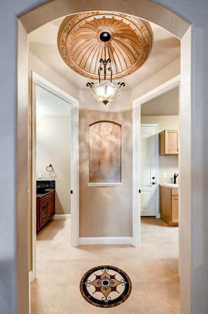 Rotunda leading to the laundry room and powder bath.