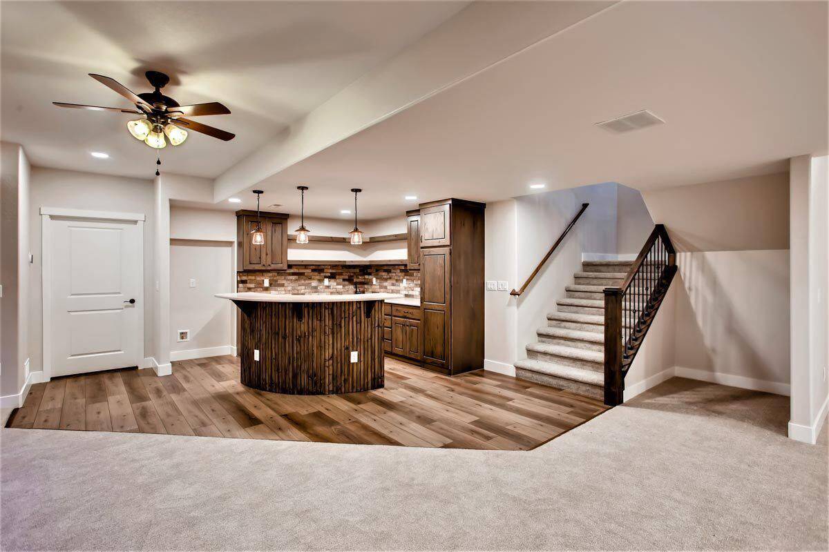 Basement with rec room and a wet bar.