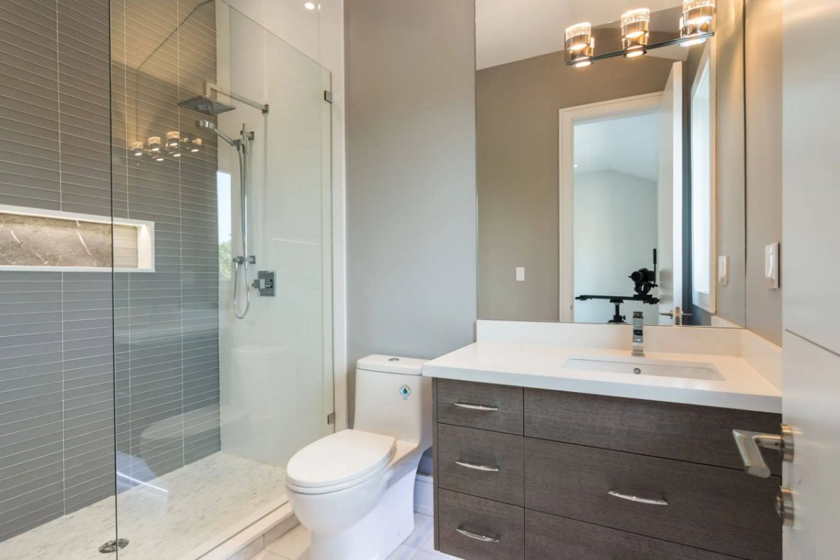 Bathroom with a sink, shower and toilet.