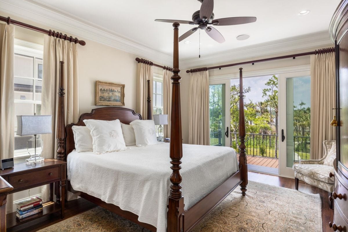 Bedroom with sliding glass doors and a balcony.