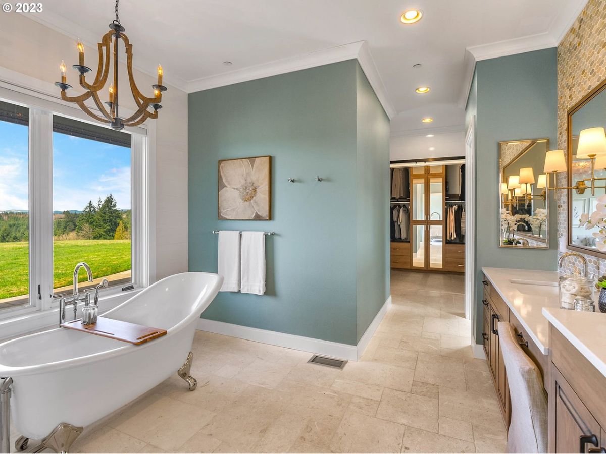 Bathroom with tile flooring, bath tub and a sink.