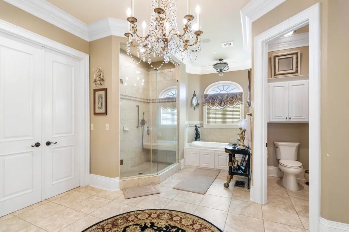 Bathroom's shower, tub and toilet.