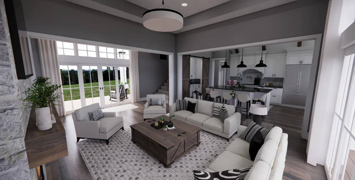 Great room with gray seats and a rustic coffee table over the patterned area rug.