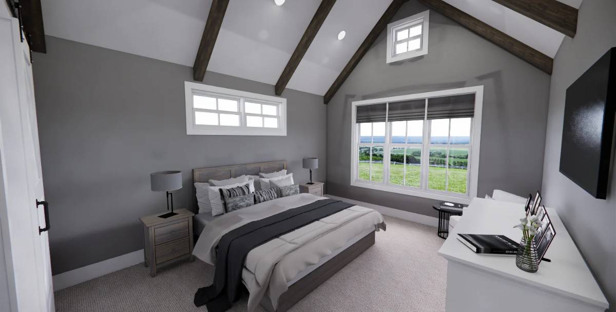 Primary bedroom with a wooden bed, a wall-mounted TV, and a cathedral ceiling accentuated with exposed beams.