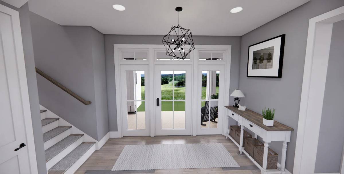 The foyer includes a glazed entry door and a wooden console table topped with a framed artwork.