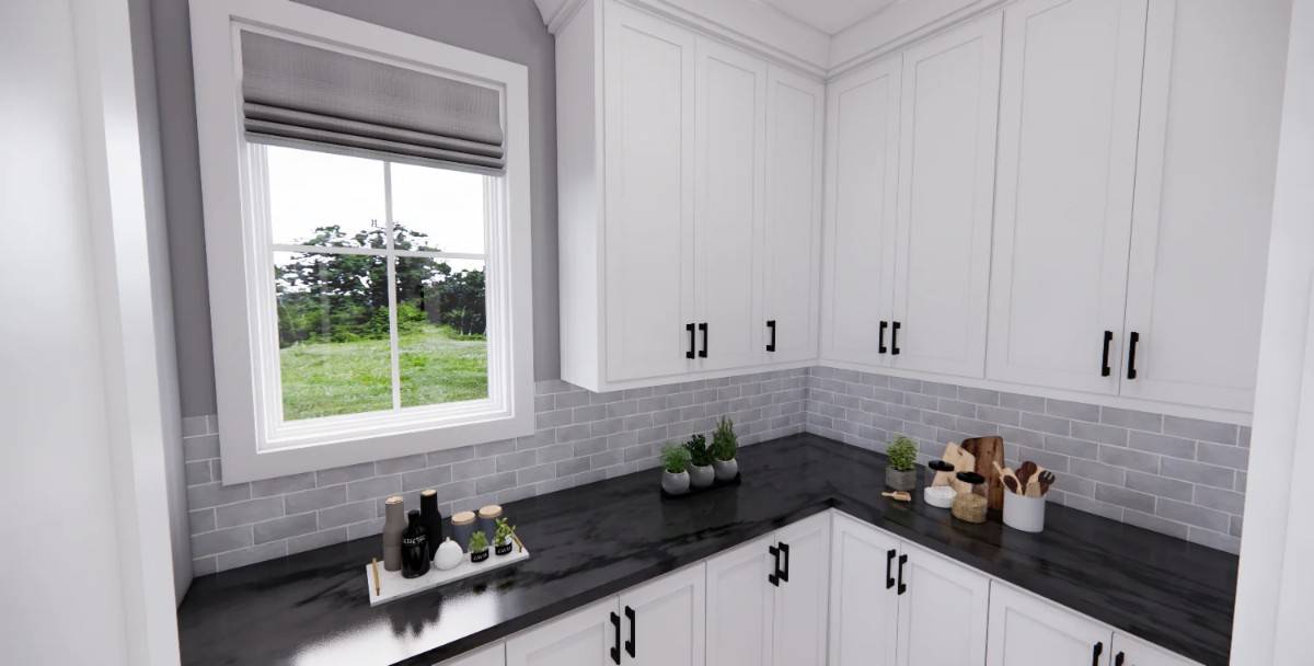 Walk-in pantry with white cabinetry, marble countertops, and a framed window that brings natural light in.