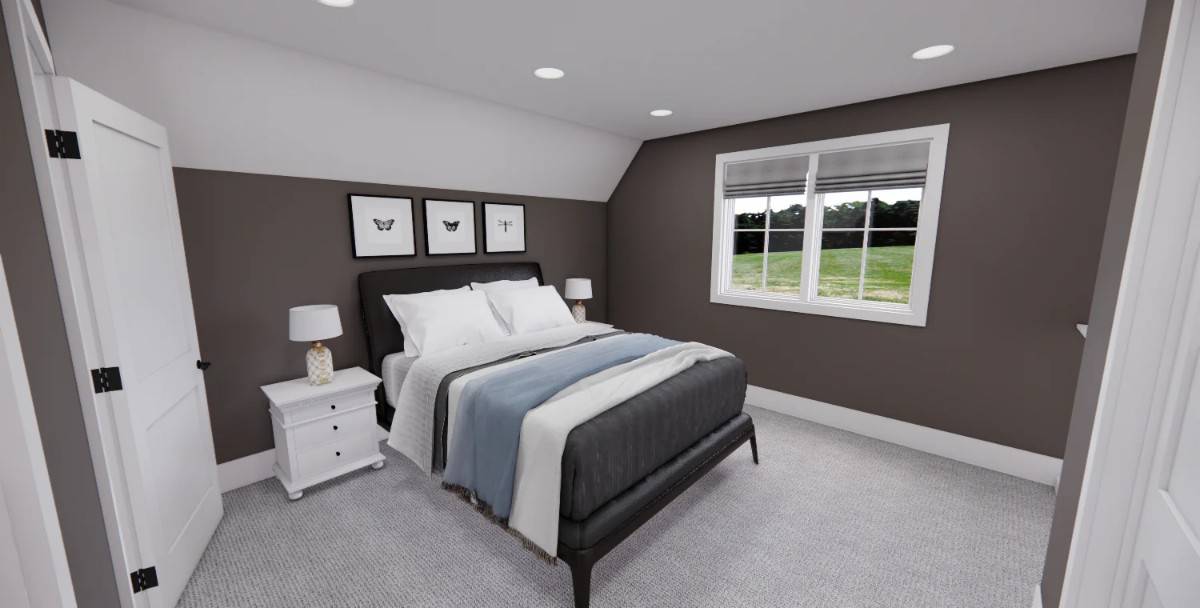 Second bedroom with dark gray walls, a vaulted ceiling, and a platform bed over the carpeted floor.