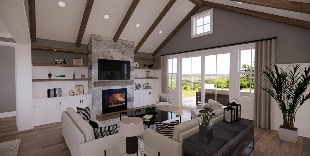 Great room with a stone fireplace and gray seats under a vaulted ceiling with exposed wood beams.
