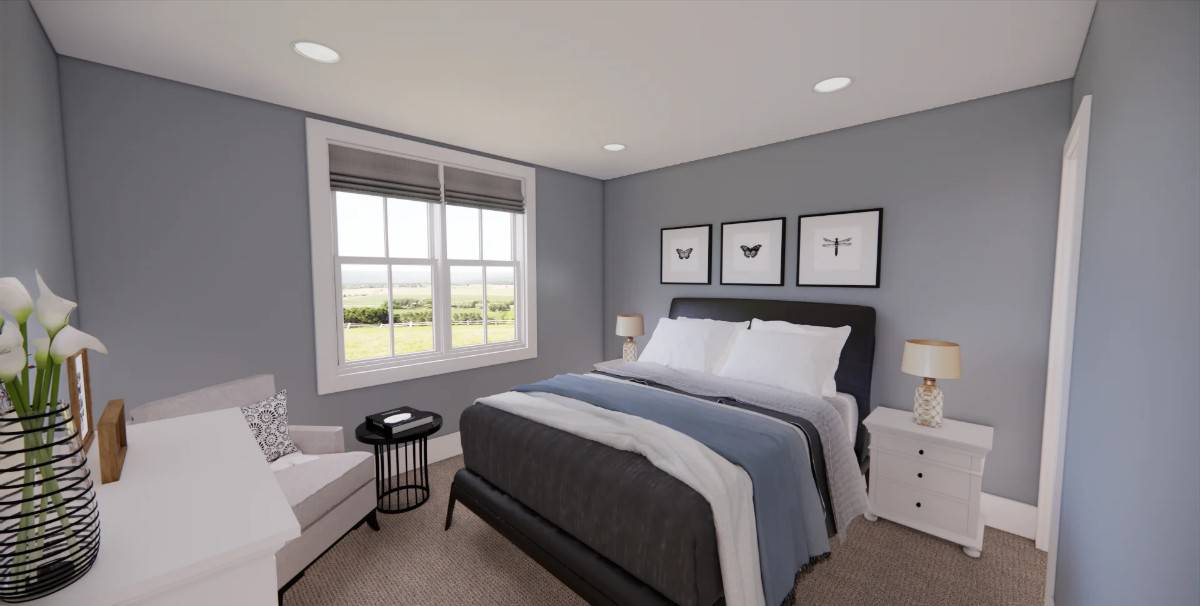 Secondary bedroom with grayish blue walls and a platform bed complemented with a cushioned armchair.