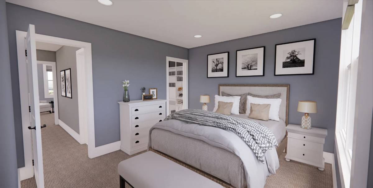 Secondary bedroom with white cabinets and a wooden bed with a bench on its end.