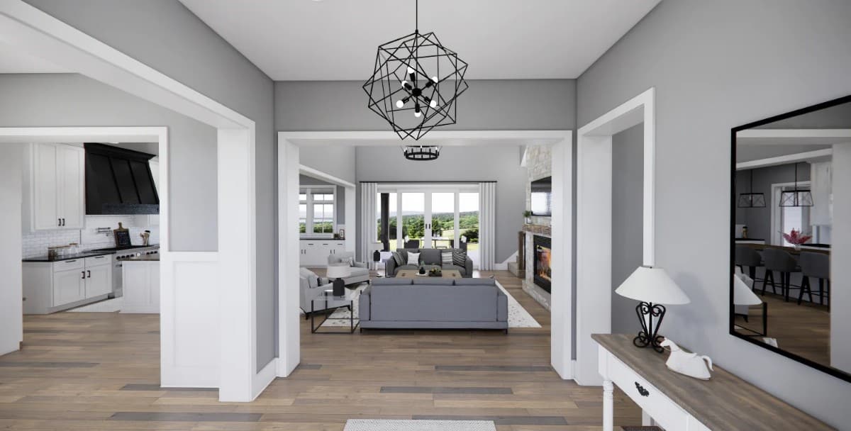 Foyer with a geometric chandelier and a view of the great room.