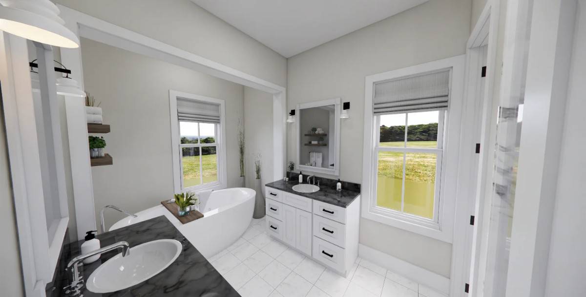 Primary bathroom with his and her vanities, a freestanding tub, and marble-tiled flooring.