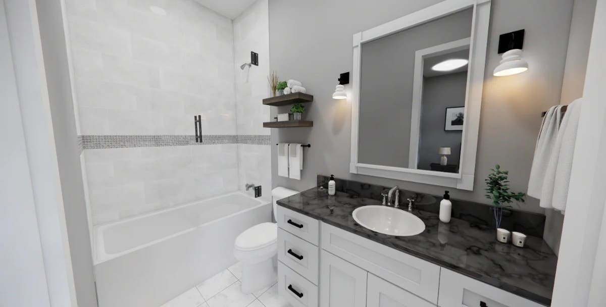 Bathroom with a sink vanity, a toilet, and a tub and shower combo.