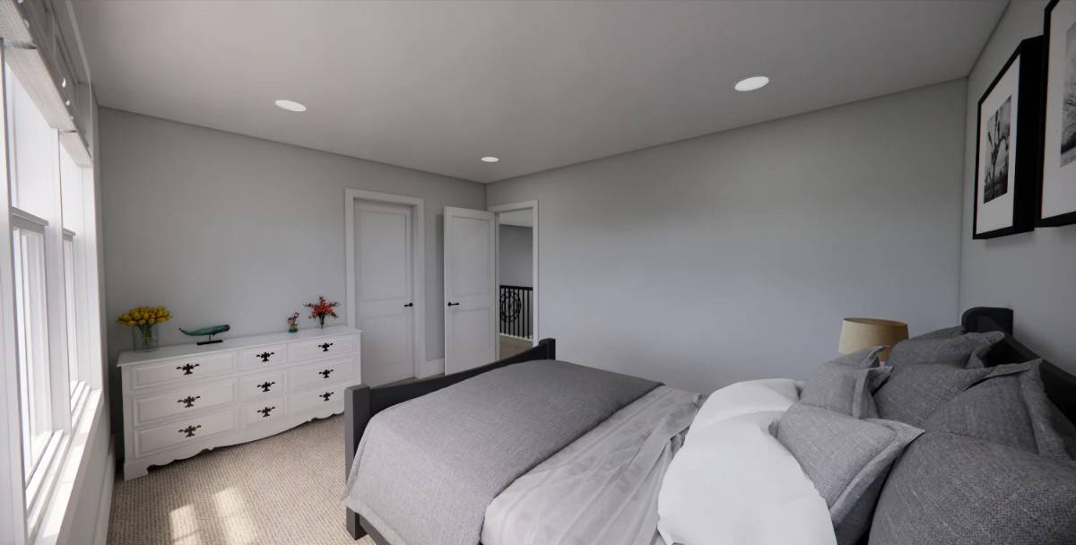 Secondary bedroom with a dark wood bed and a contrasting dresser over the carpeted floor.