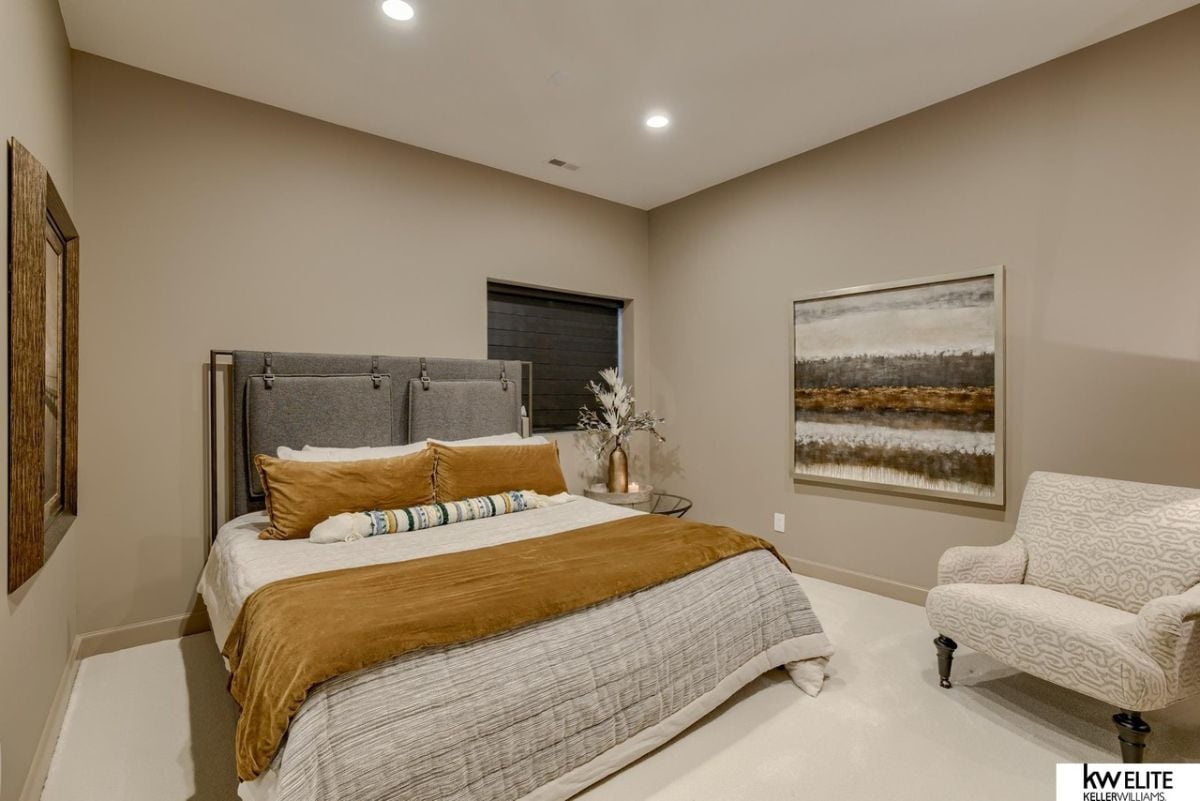 Bedroom with white and mustard colored sheets.
