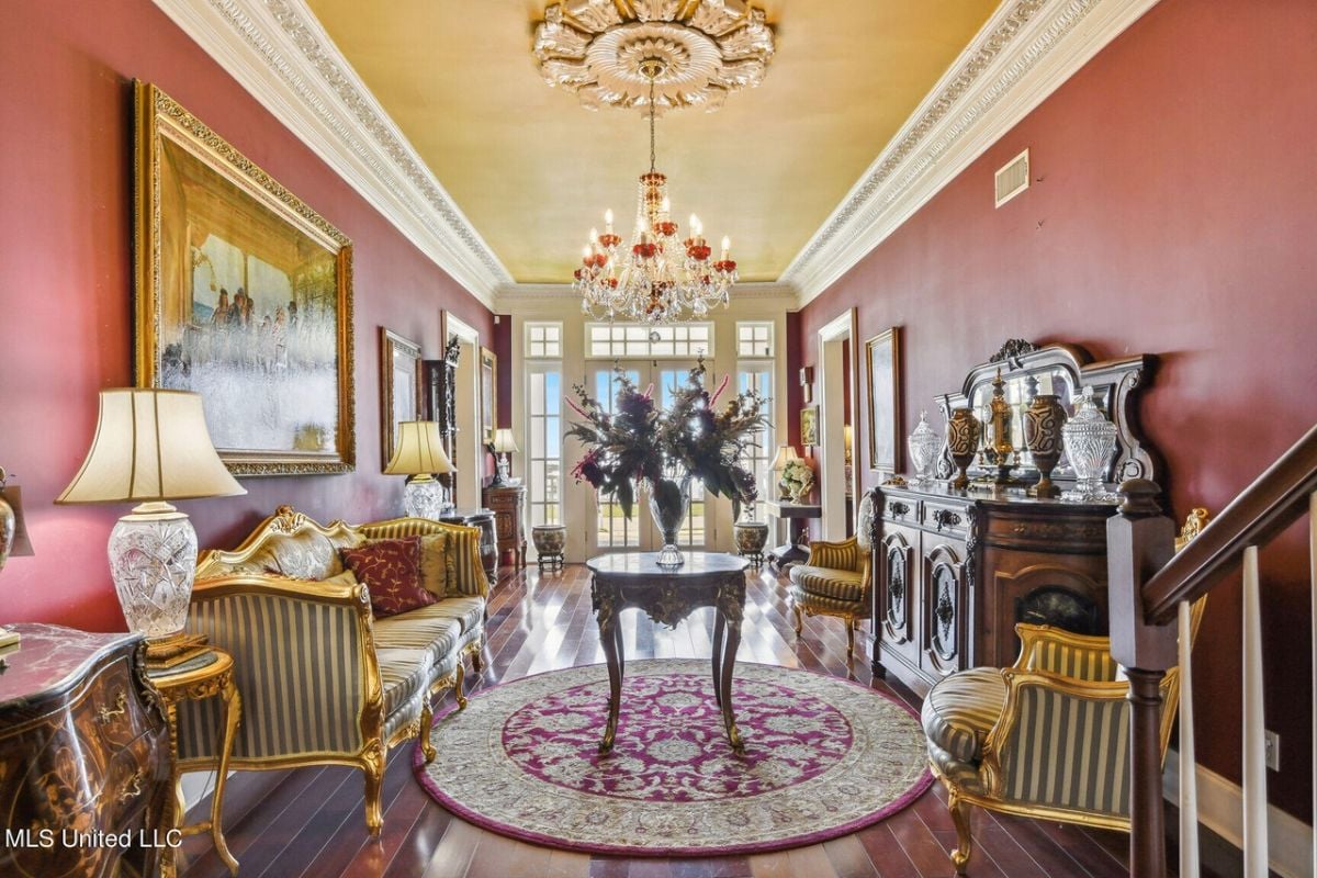 Entrance hall with sofas and entryway tables.